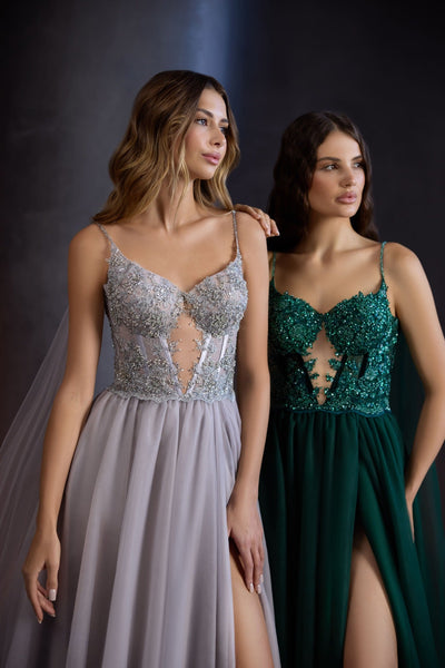 A model in a midi emerald green corset-style dress with intricate sequin embroidery and sheer tulle detailing, ideal for prom or special occasions.