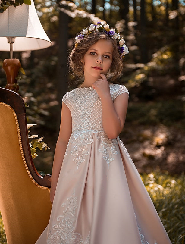 Young girl in a floral Juliana Satin and Lace Flower Girl Dress with a flower crown standing outdoors.