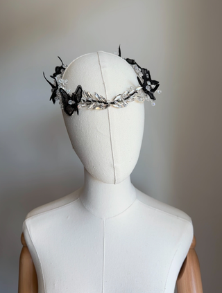 Black butterfly and crystal hairpiece on mannequin – front view