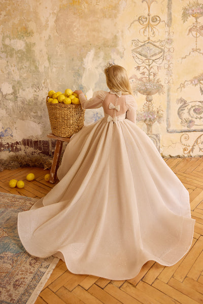 Back view of champagne flower girl gown with bows and train