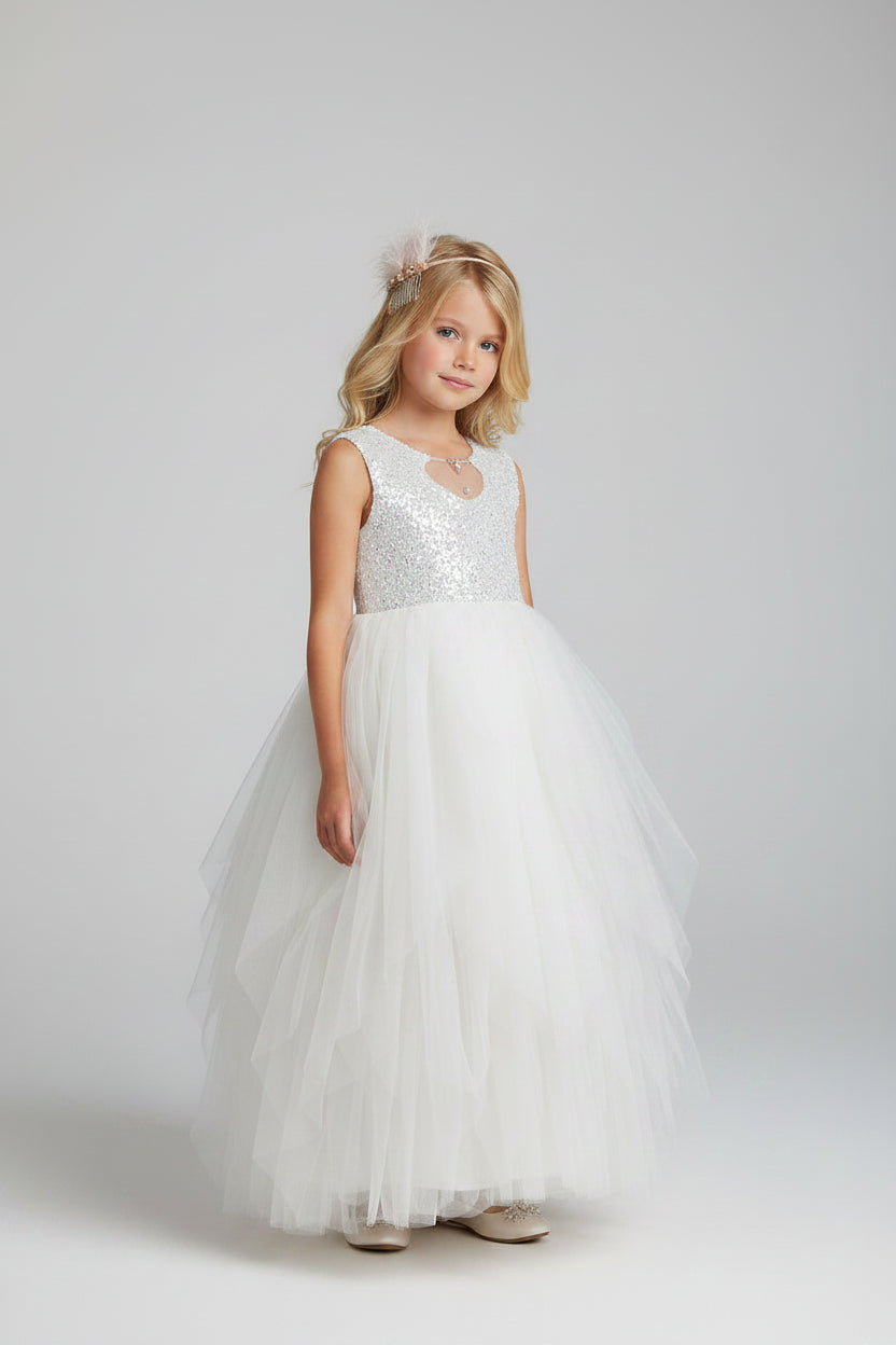 Étoile Grace sequin flower girl dress in ivory with white tulle skirt, front view on model