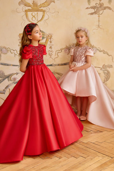 Girl in red long gown with sequin bodice and puff sleeves