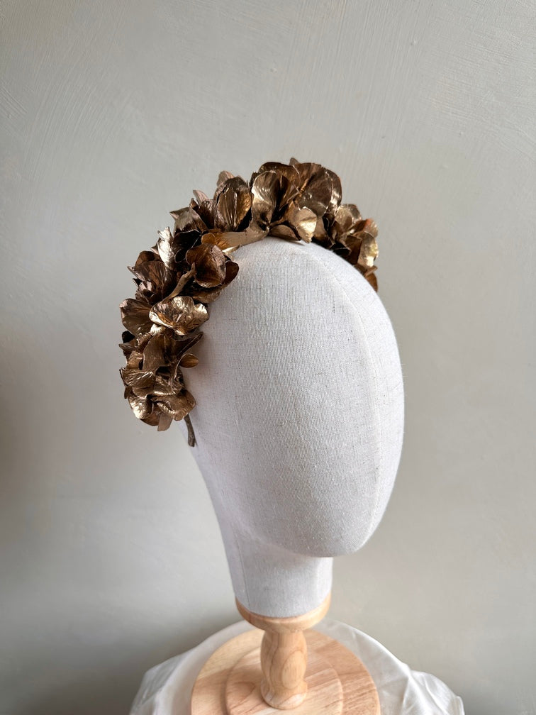 Metallic gold floral crown-style headband for weddings and pageants