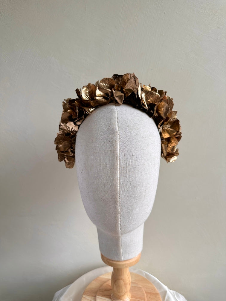 Metallic gold floral crown-style headband for weddings and pageants