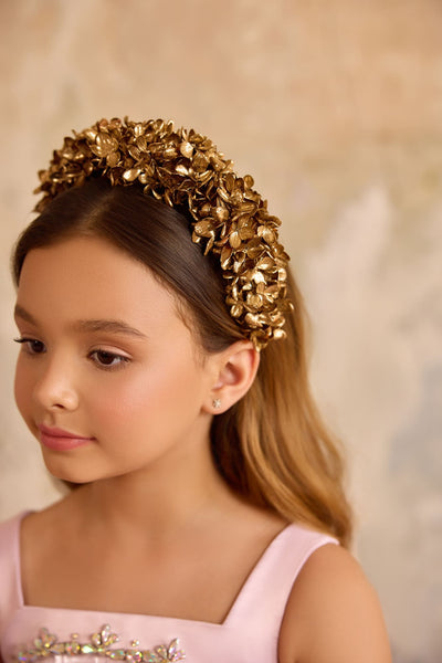 Close-up of girl wearing gold hydrangea flower headband for weddings and special occasions