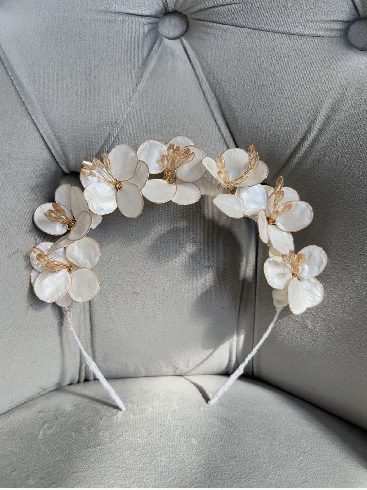 Handmade ivory flower crown headband with mother-of-pearl petals and golden accents for girls’ special occasions