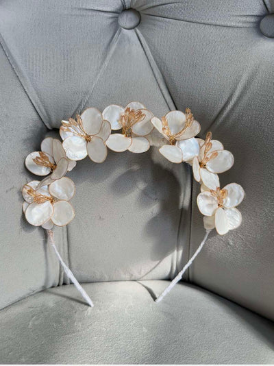 Handmade ivory flower crown headband with mother-of-pearl petals and golden accents for girls’ special occasions