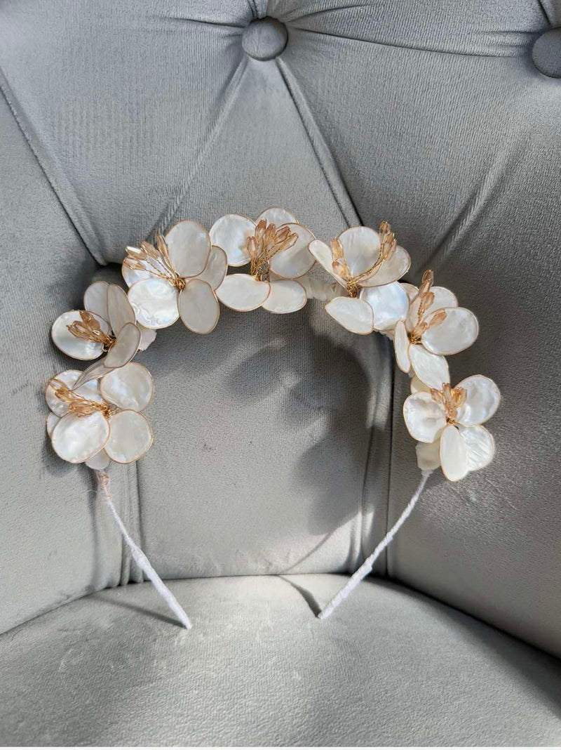 Handmade ivory flower crown headband with mother-of-pearl petals and golden accents for girls’ special occasions