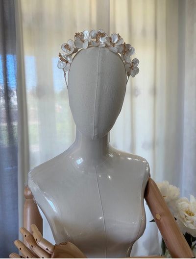 Handmade ivory flower crown headband with mother-of-pearl petals and golden accents for girls’ special occasions