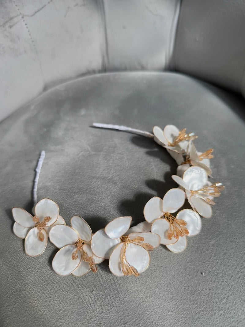 Handmade ivory flower crown headband with mother-of-pearl petals and golden accents for girls’ special occasions