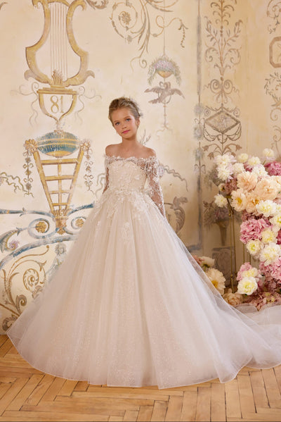 Girl in ivory lace flower girl dress with long sleeves and full skirt