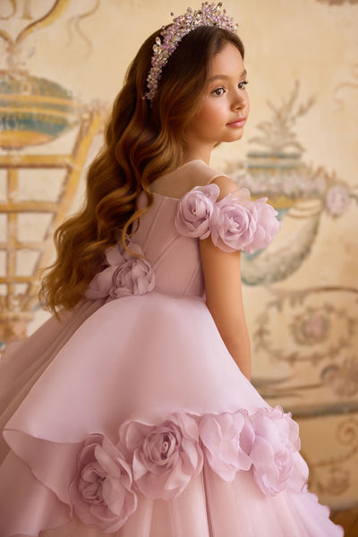 Girl wearing lilac flower girl gown with off-shoulder floral straps