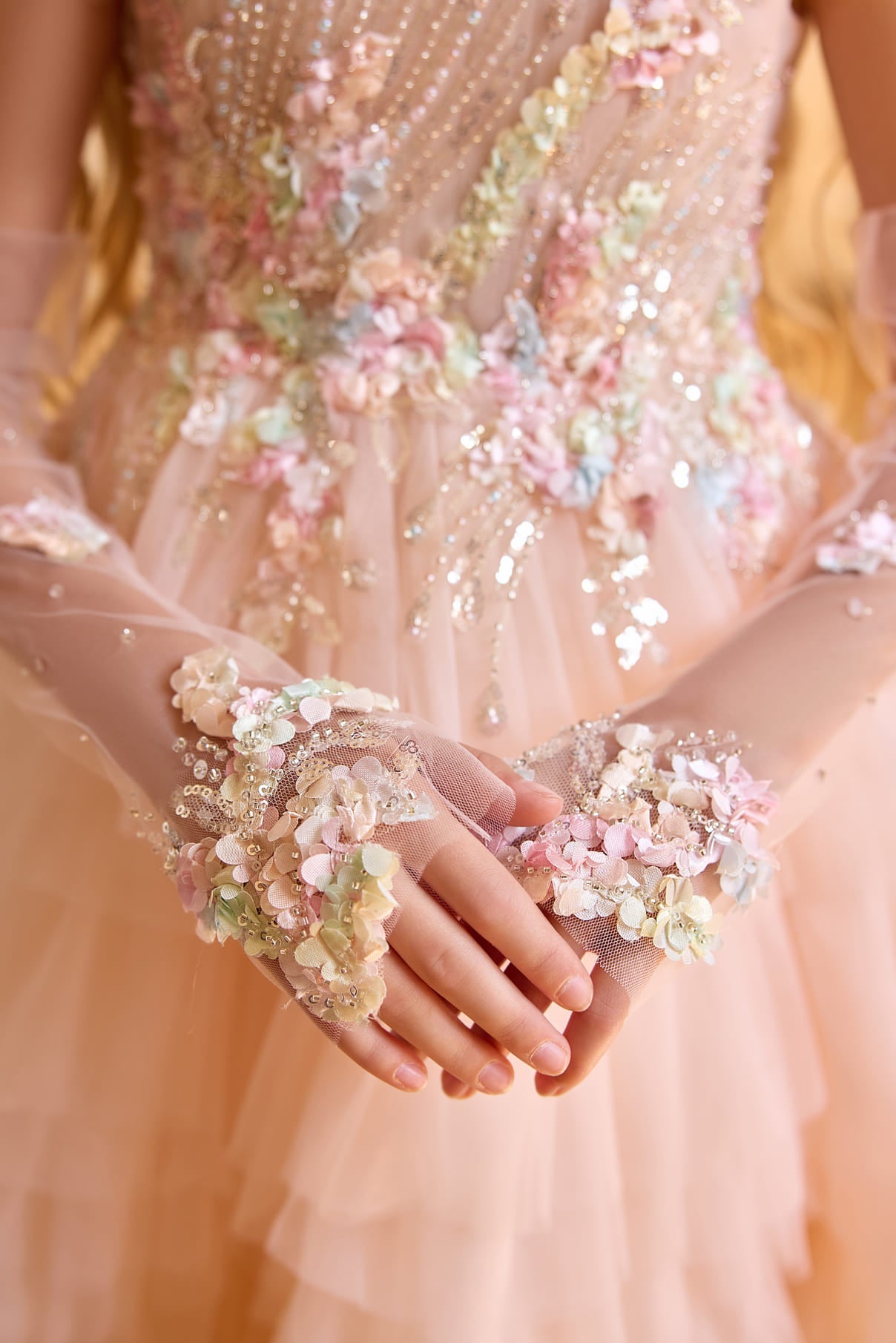 Detailed floral embroidery and sequined illusion gloves on couture girls gown Mia Bambina Boutique