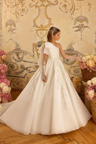 One-shoulder First Communion dress with oversized bow and beaded details in off-white