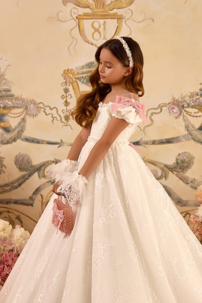 Flower girl holding pink crystal communion purse with bow detail
