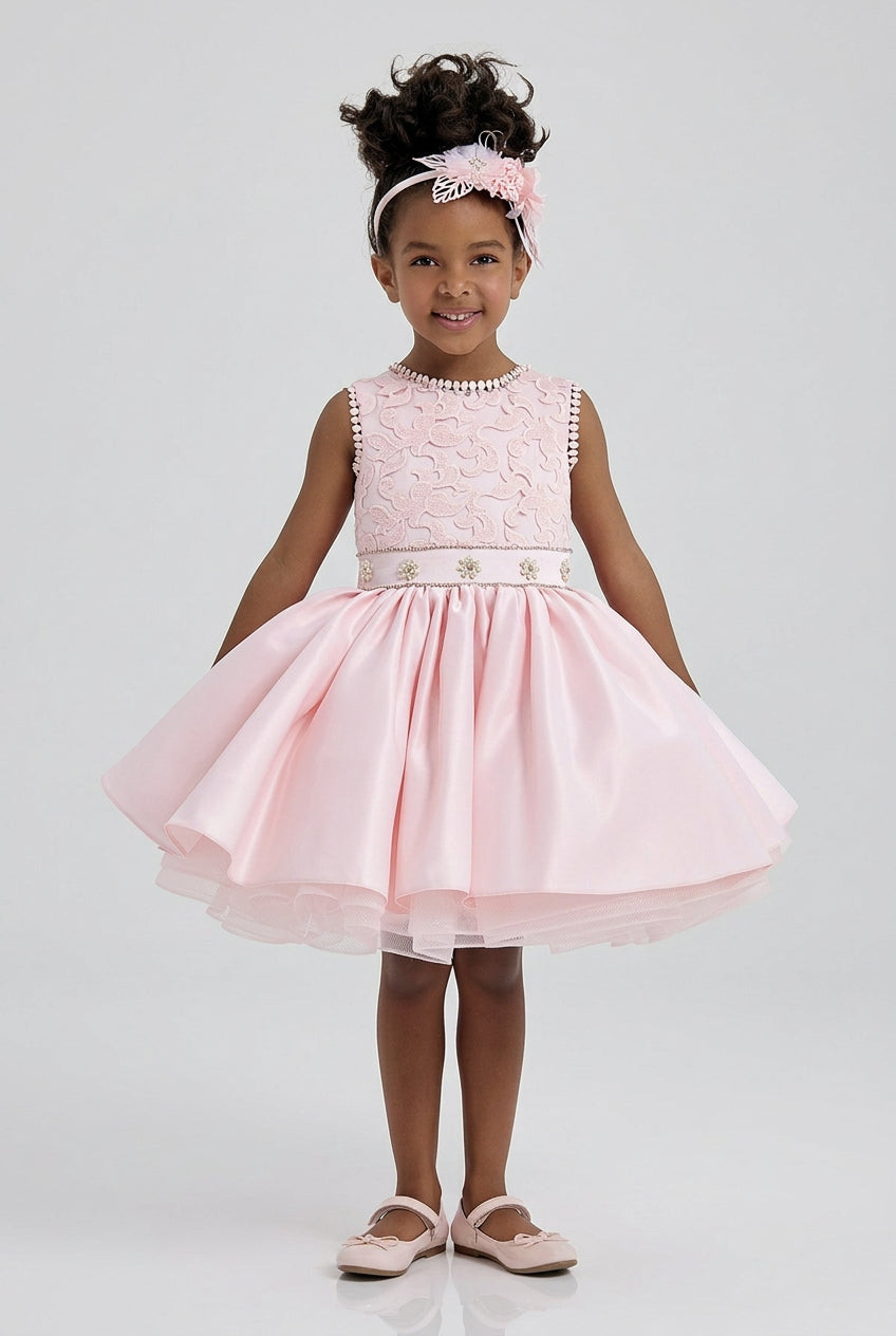 Girl twirling in the pink flower girl dress showing the tulle underskirt at the hem by Mia Bambina Boutique