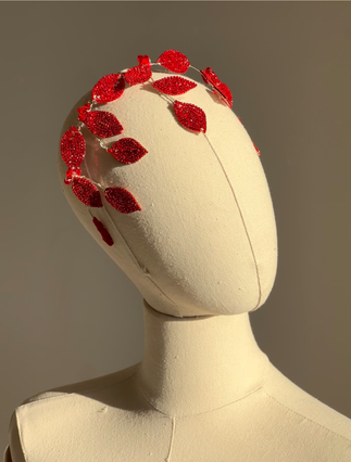 Red crystal leaf headband on mannequin – angled view