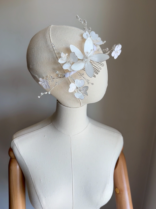 Handmade white floral comb hairpiece with translucent petals and crystal sprays for girls’ communion or wedding