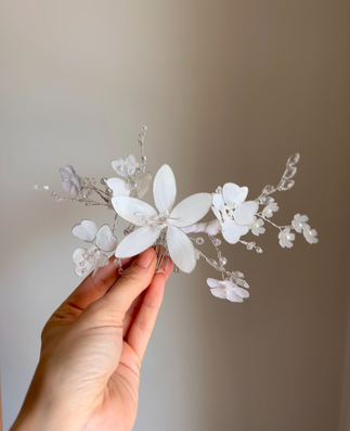 Handmade white floral comb hairpiece with translucent petals and crystal sprays for girls’ communion or wedding