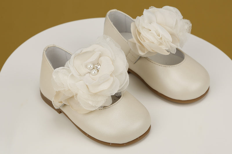 White baby girl Mary Jane shoes with large flower appliqué