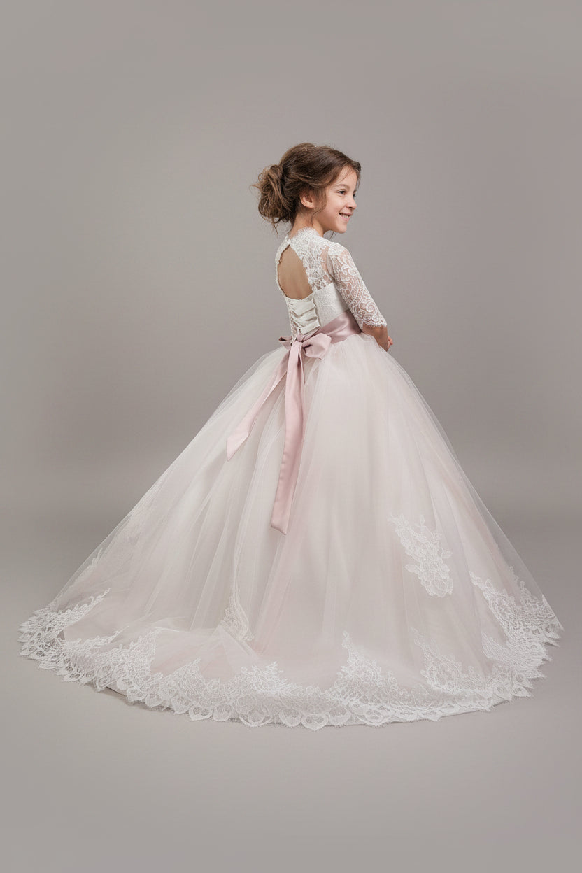 Back view of blush First Communion dress with lace sleeves and satin bow - Mia Bambina Boutique