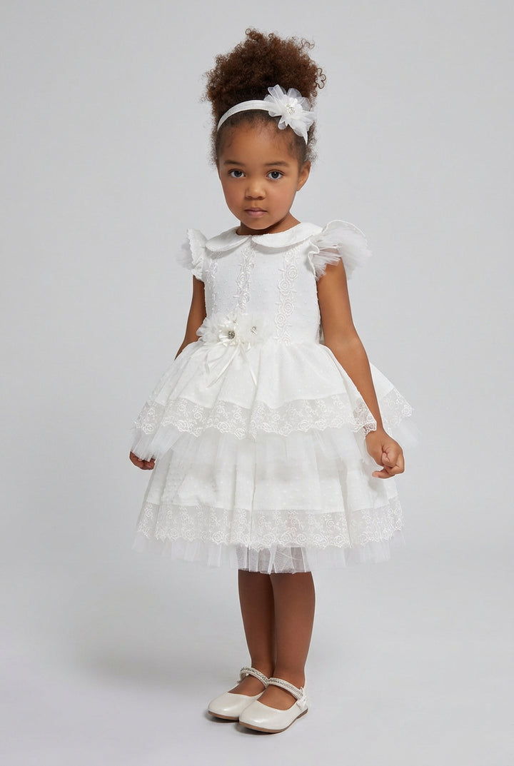 Sarah baby christening dress in off white with Peter Pan collar and three lace tiers, front view on toddler - Mia Bambina Boutique